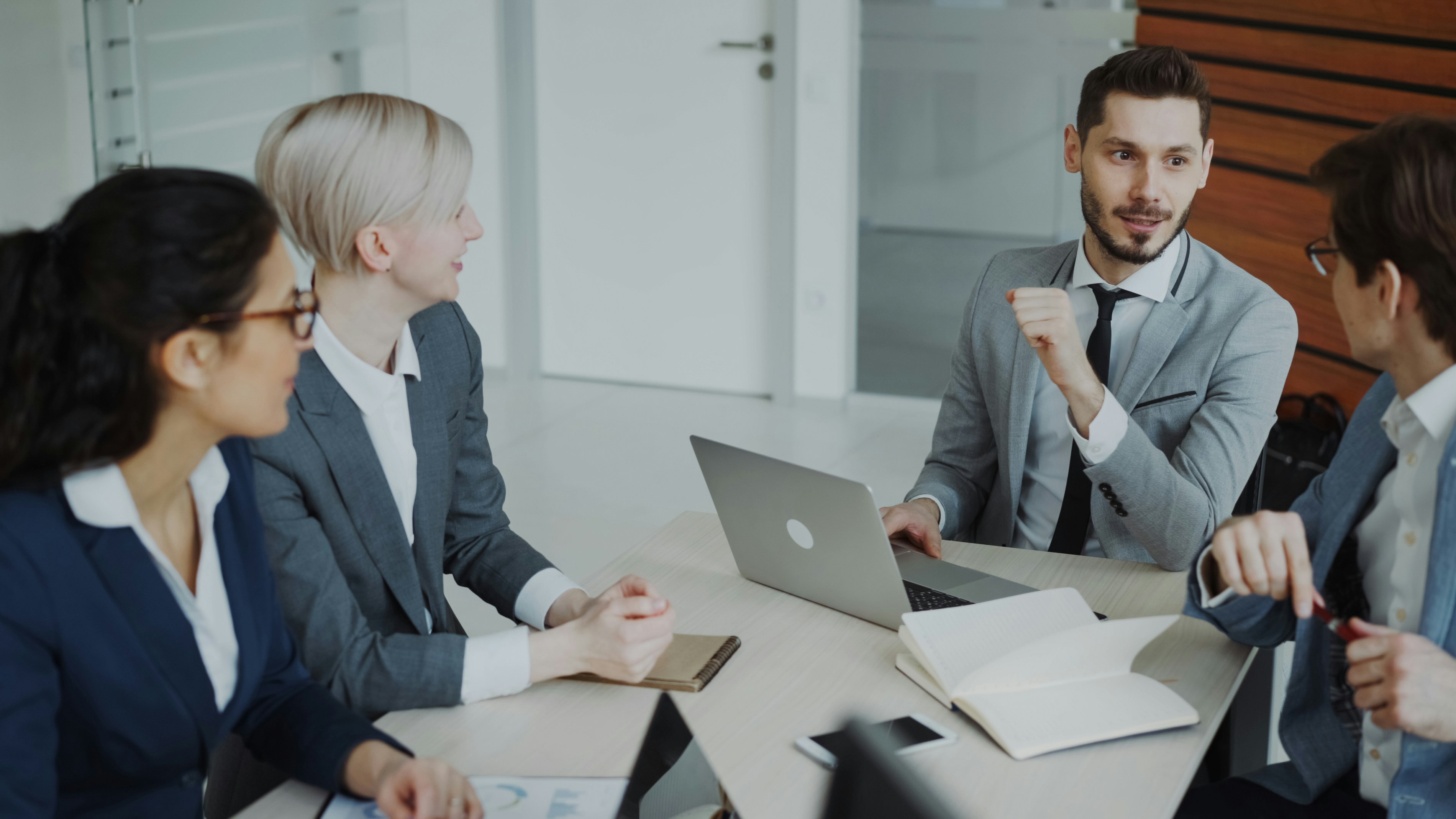 Small business team discussing employee group benefits during a meeting